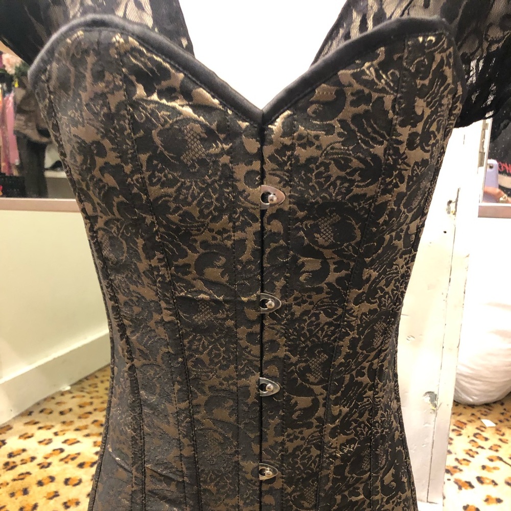 Small, black and gold Daisy brand corset